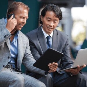 businessmen-cell-tablet-laptop