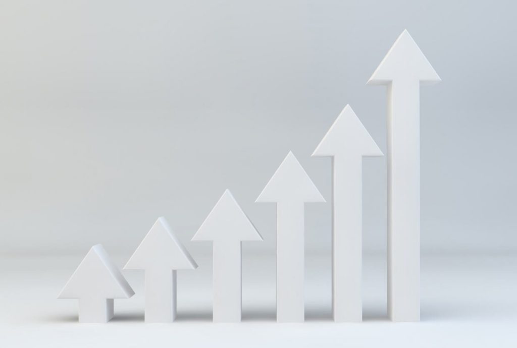 White arrows pointing upward and getting taller