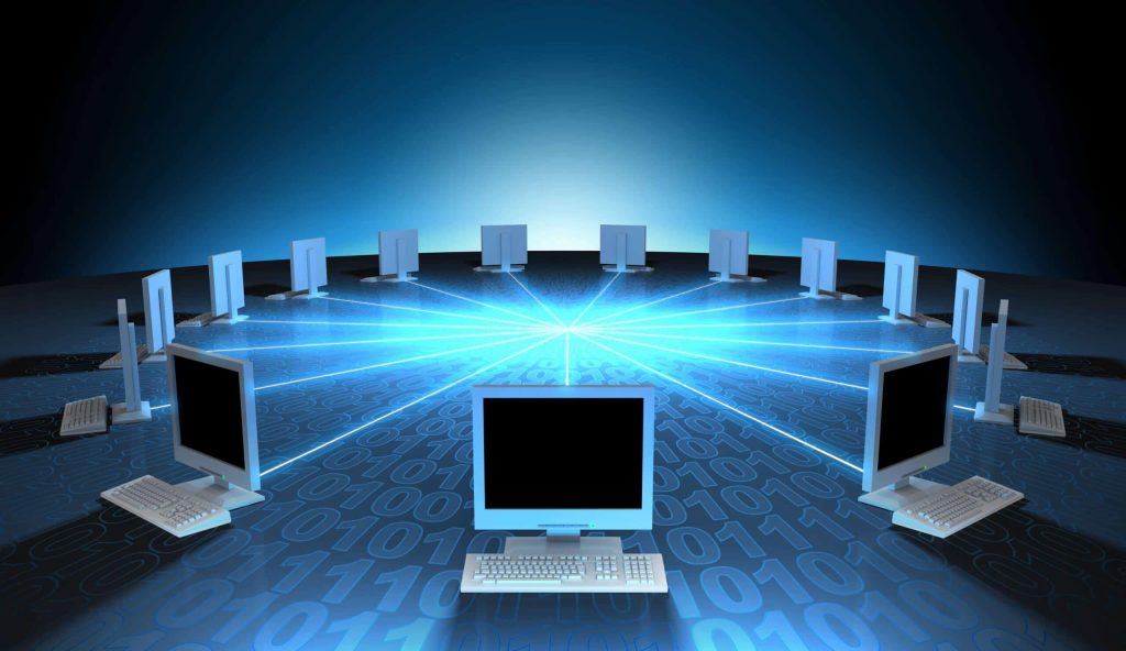 several desktop monitors in a circle all connected by a blue LED line
