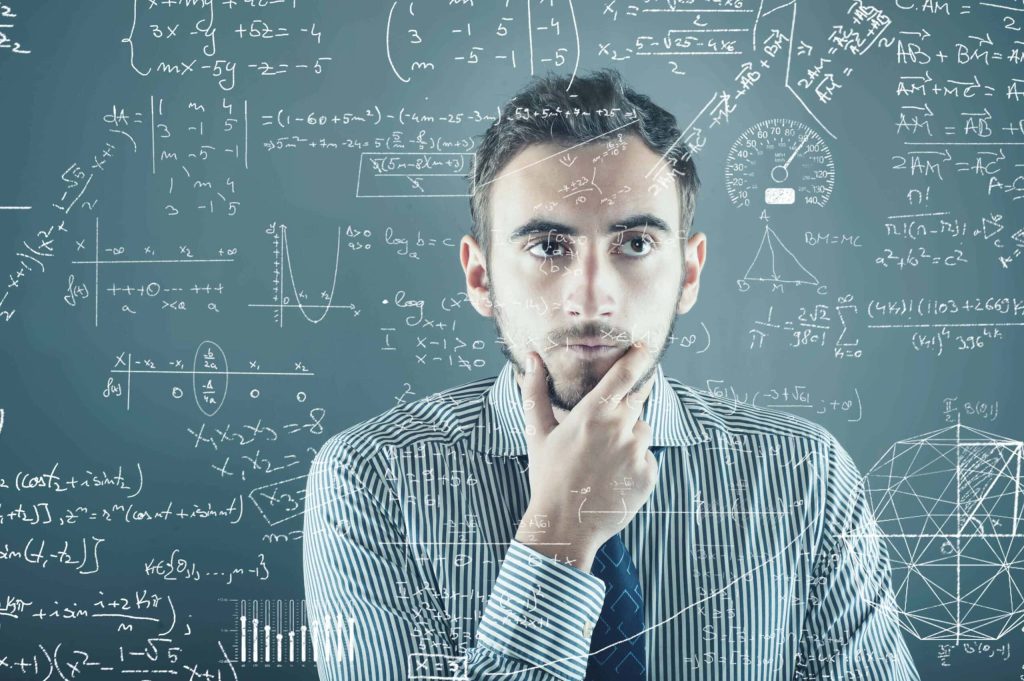 Business man doing mental math, formulas floating around him.