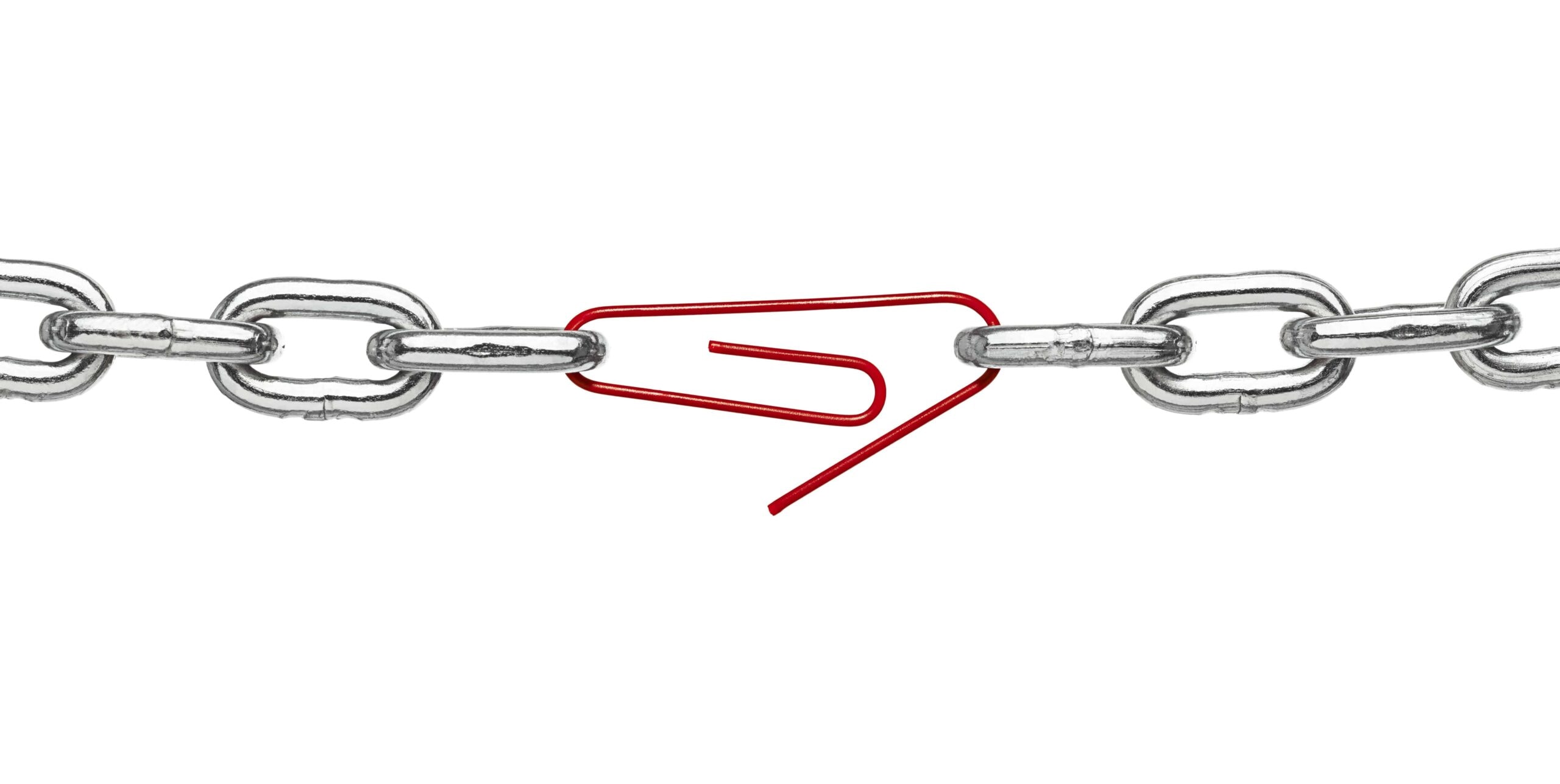 Silver metal chains connected by red paperclip in the middle.