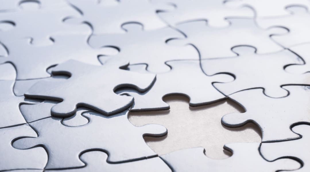 the missing puzzle piece next to the open space in the puzzle