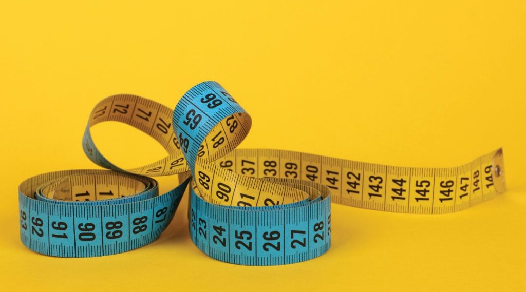 a two sided blue and yellow measuring tape.