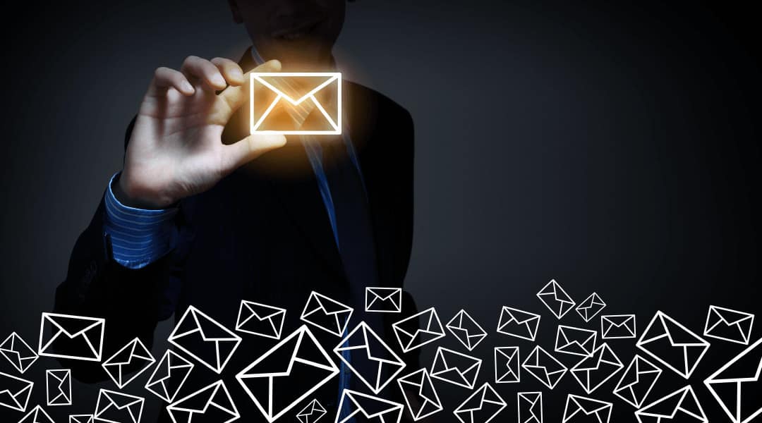 close up of a person holding a gold LED email icon