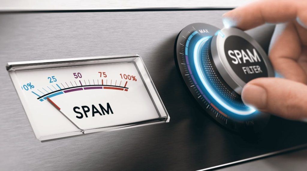a person adjusting the spam filter to the max next to a spam speedometer showing 5% spam