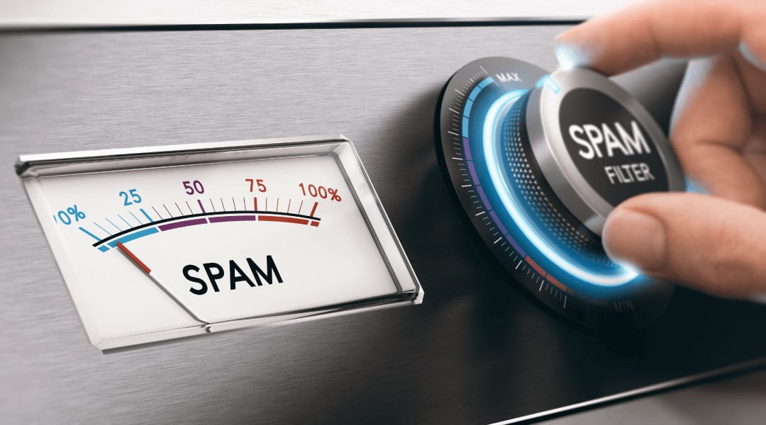 a person adjusting the spam filter to the max next to a spam speedometer showing 5% spam