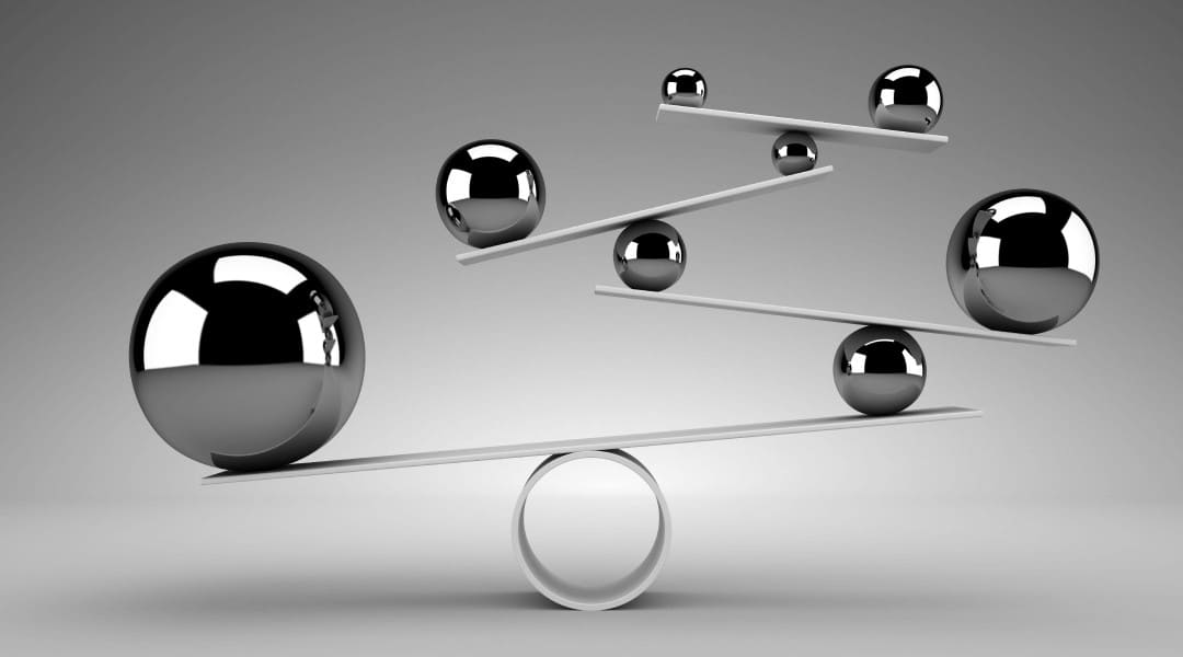 Balls balancing on multiple seesaws