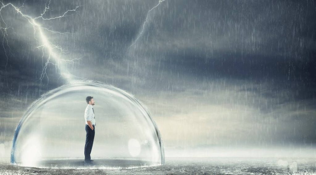 a professional individual standing in a glass dome being protection from a lightning rain storm.