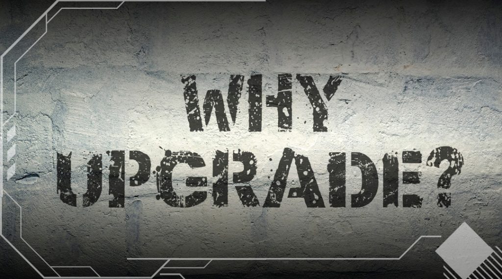 "WHY UPGRADE" printed in black on a concrete wall
