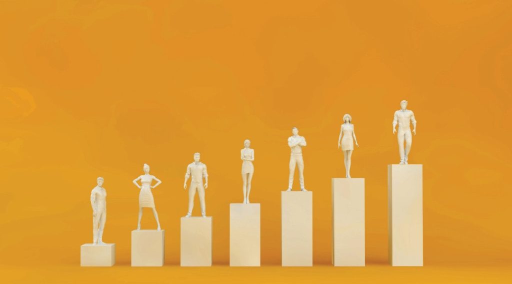 gold professional individual statues standing on gold column blocks arranged in ascending order.