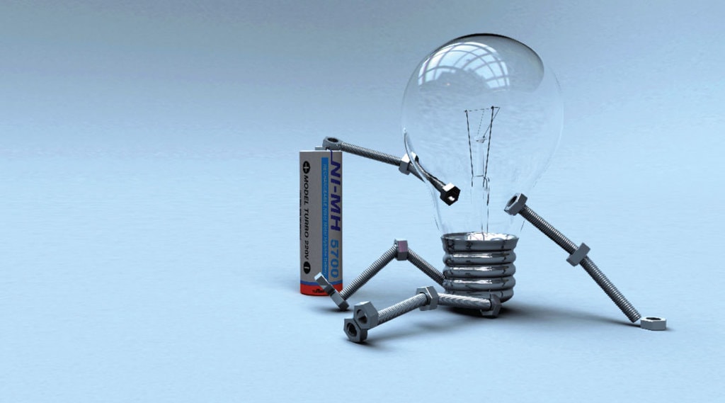 A lightbulb with head screws and bolts as arms and legs leaning on a 220 volt battery.