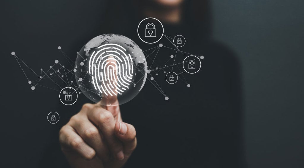 a close up of a fingerprint in the center of a world globe with lines and nodes branching out to unlock different destinations.