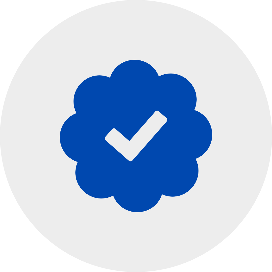 Blue verification badge in a grey circle.