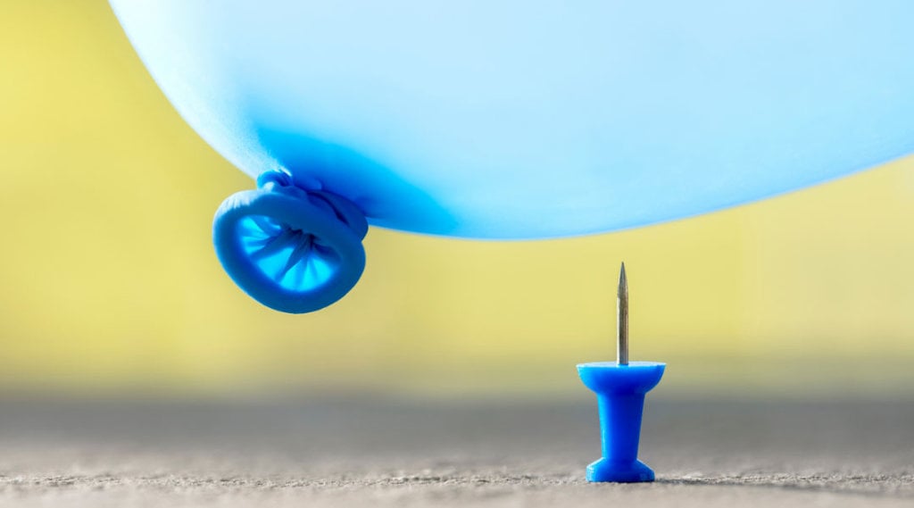 Blue Balloon Above Blue Thumbtack