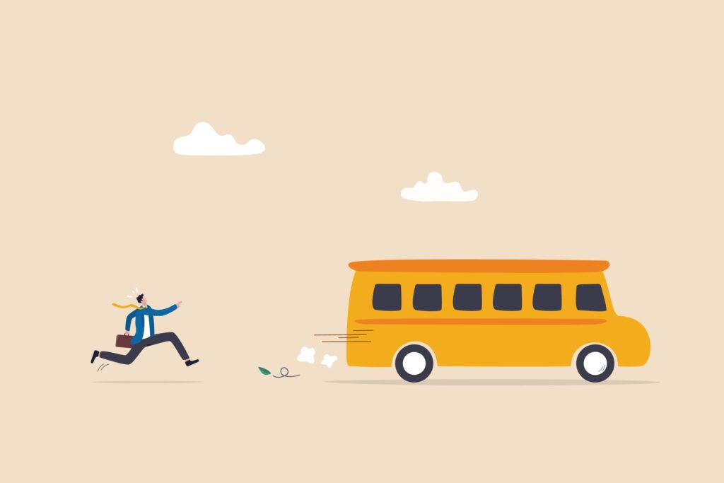 a person running behind a bus that has started moving