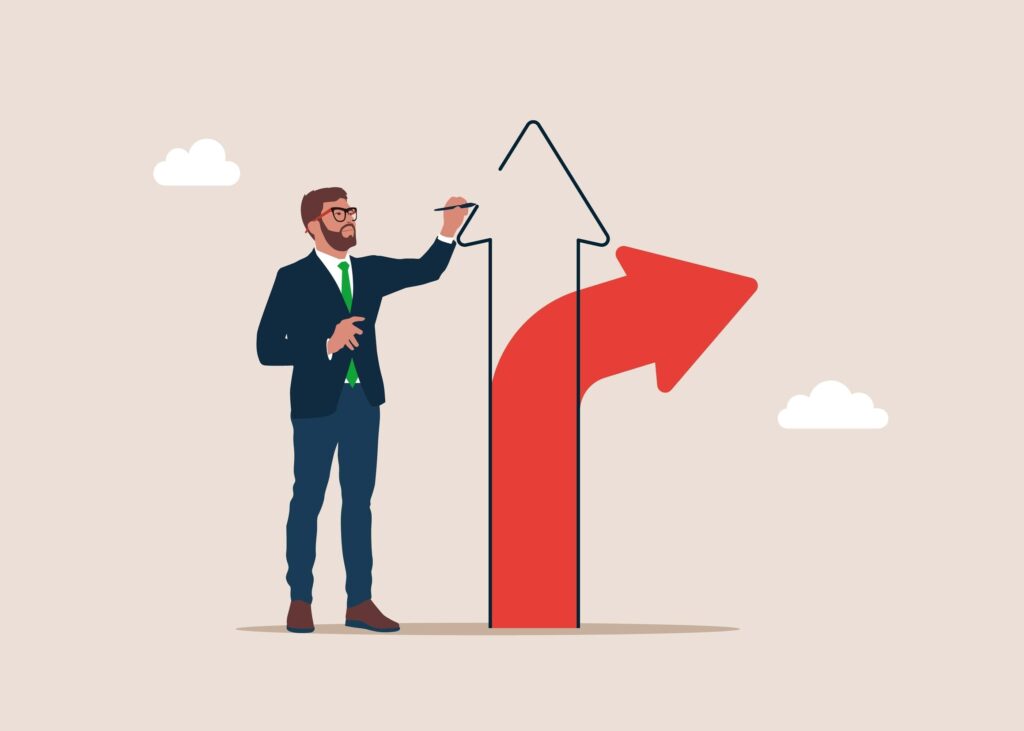 an arrow being drawn in a new direction by businessman